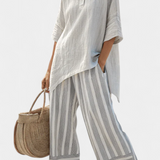 Десислава - комплект Дейзи с асиметрична блуза и райе панталони за модерен и елегантен стил