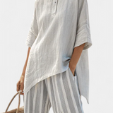 Десислава - комплект Дейзи с асиметрична блуза и райе панталони за модерен и елегантен стил